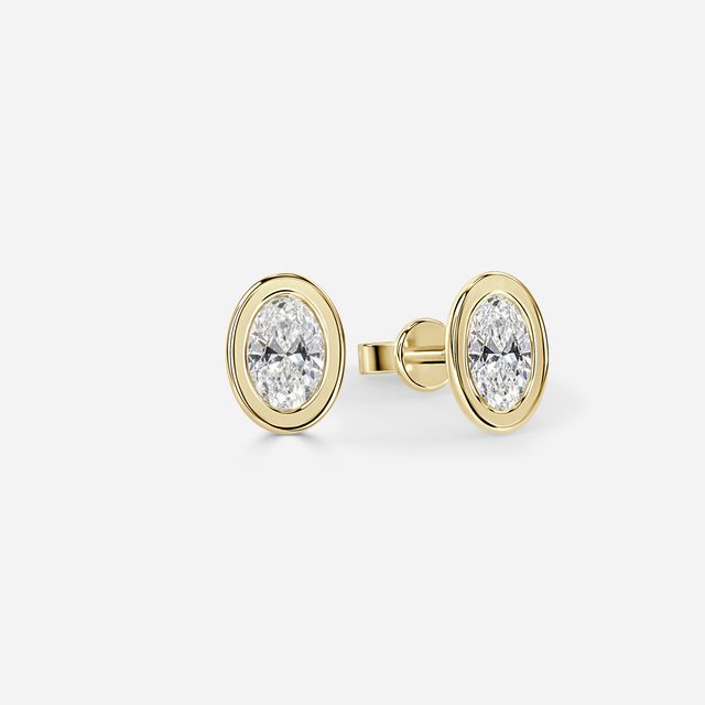 Bezel Set Oval Cut Diamond Studs In Yellow Gold