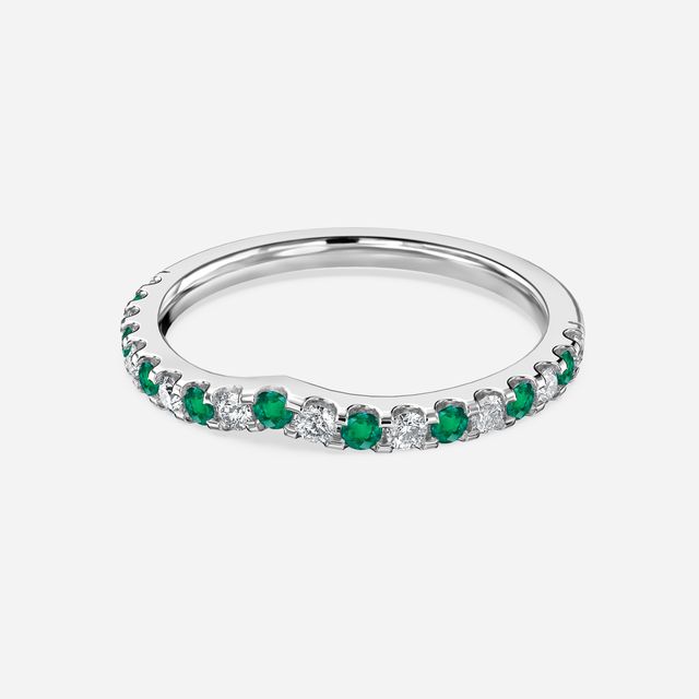Curved White Gold Claw Set With Diamond And Green Emerald