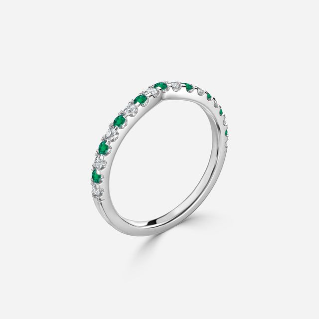 Curved White Gold Claw Set With Diamond And Green Emerald