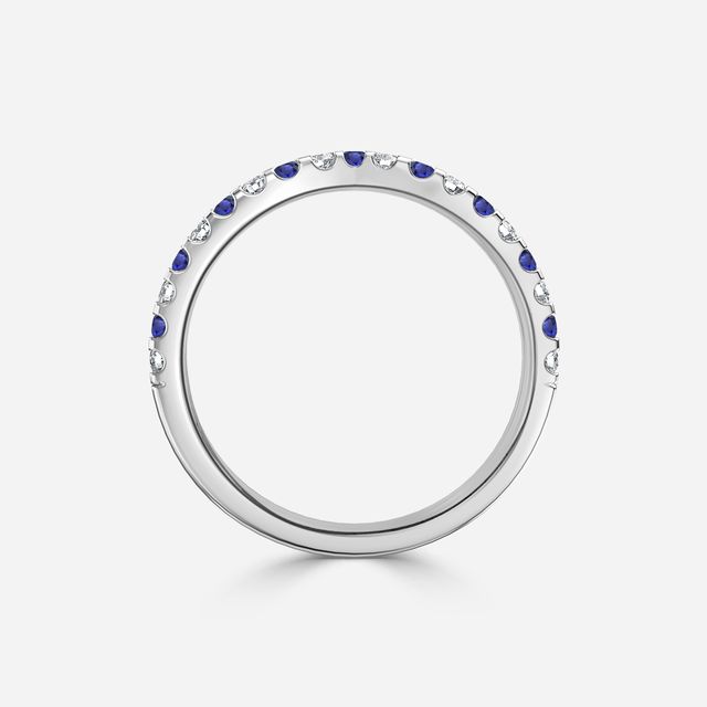 Curved White Gold Claw Set With Diamond And Blue Sapphire