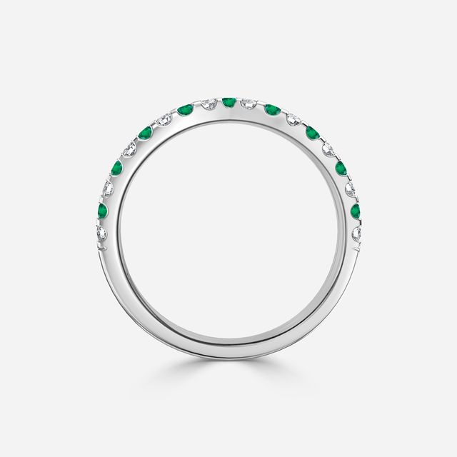 Curved White Gold Claw Set With Diamond And Green Emerald