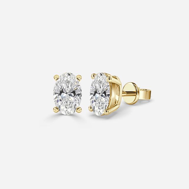 Oval Diamond Stud Earrings In Yellow Gold