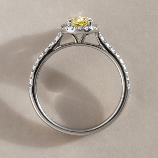 Yellow Oval Diamond Halo Engagement Ring in Platinum - 0.66ct