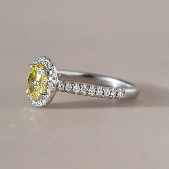 Yellow Oval Diamond Halo Engagement Ring in Platinum - 0.66ct