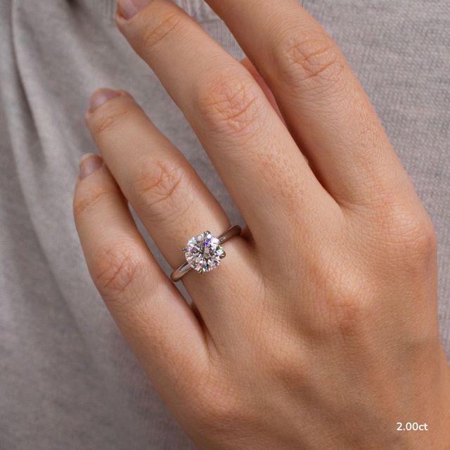 Firework Platinum Solitaire Engagement Ring
