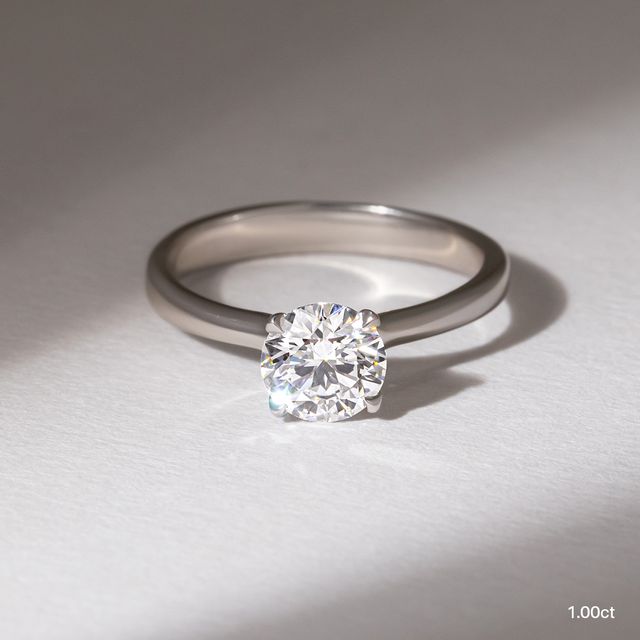 Firework Platinum Solitaire Engagement Ring