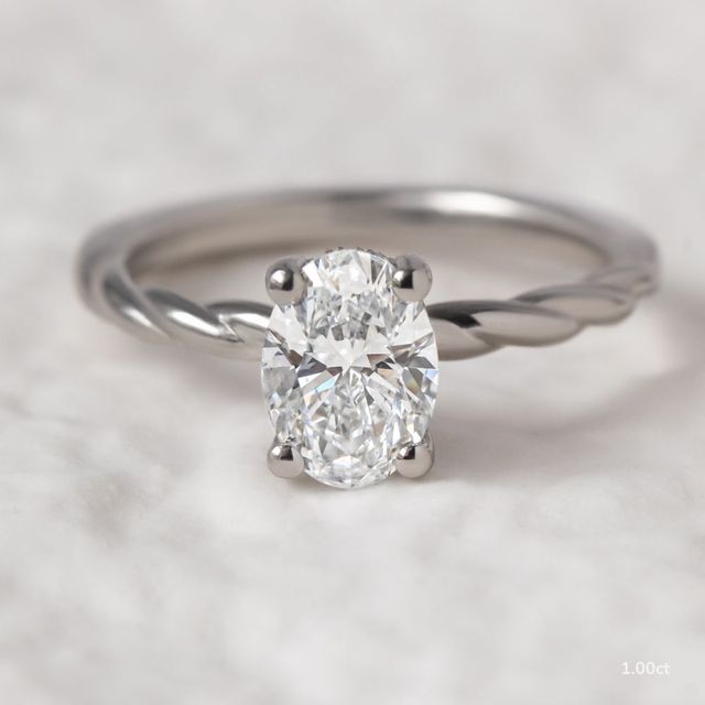Midas Twisted Band Solitaire Platinum Engagement Ring