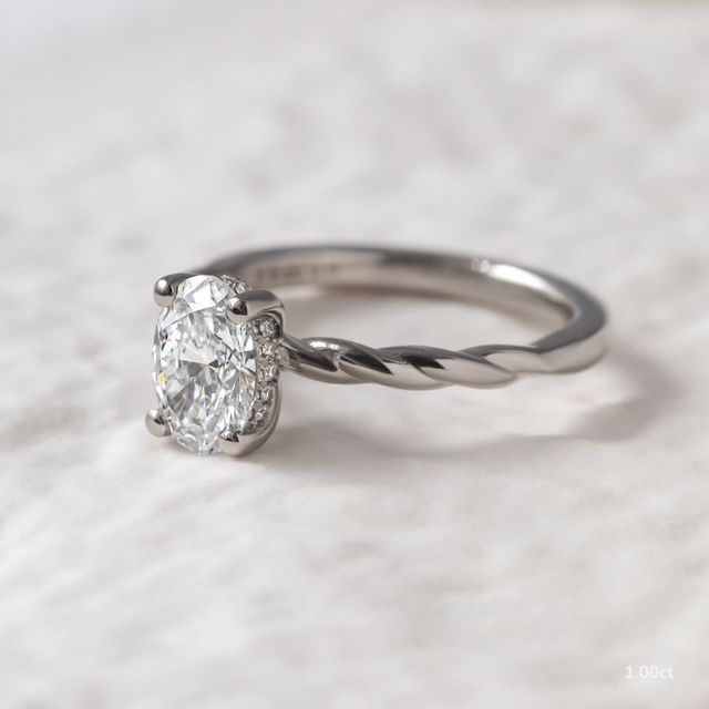 Midas Twisted Band Solitaire Platinum Engagement Ring