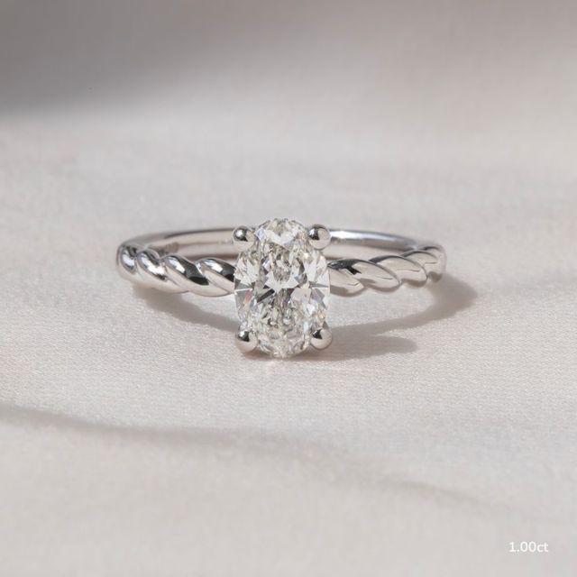 Midas Twisted Band Solitaire Platinum Engagement Ring