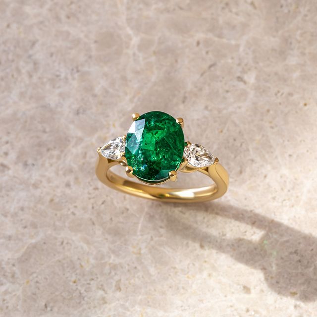 3 ct Oval Zambian Emerald Yellow Gold Trilogy Engagement Ring