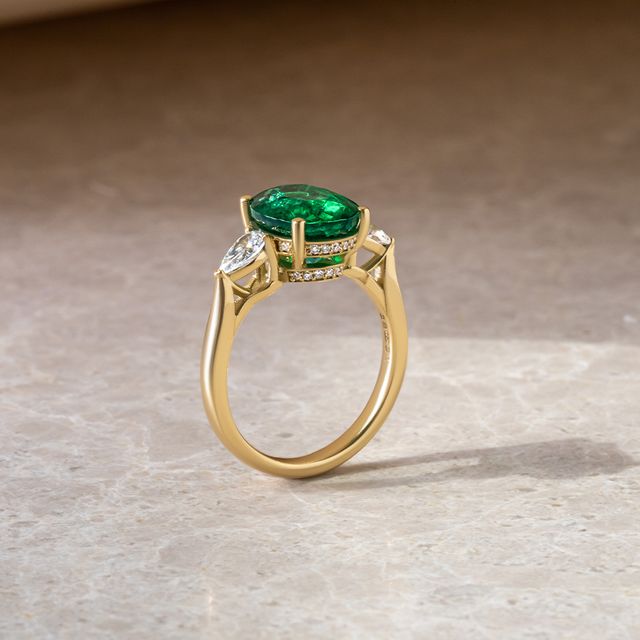 3 ct Oval Zambian Emerald Yellow Gold Trilogy Engagement Ring