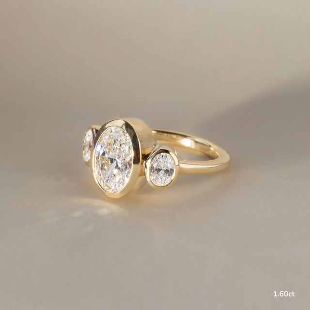Varani Yellow Gold Three Stone Bezel Engagement Ring