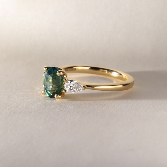 1.70 Carat Oval Natural Teal Sapphire Trilogy Ring In Yellow Gold -Vivian