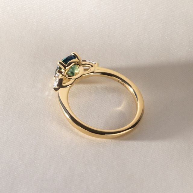 1.70 Carat Oval Natural Teal Sapphire Trilogy Ring In Yellow Gold -Vivian