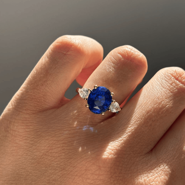 5.09 Carat Oval Blue Sapphire Trilogy Engagement Ring In Yellow Gold - Nimi