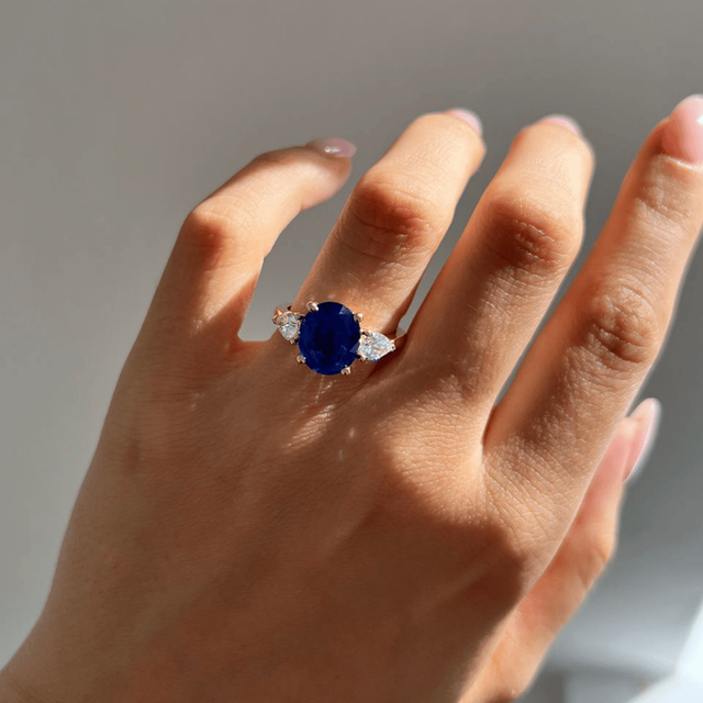 5.09 Carat Oval Blue Sapphire Trilogy Engagement Ring In Yellow Gold - Nimi