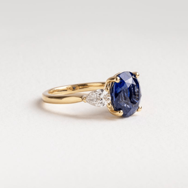 5.09 Carat Oval Blue Sapphire Trilogy Engagement Ring In Yellow Gold - Nimi