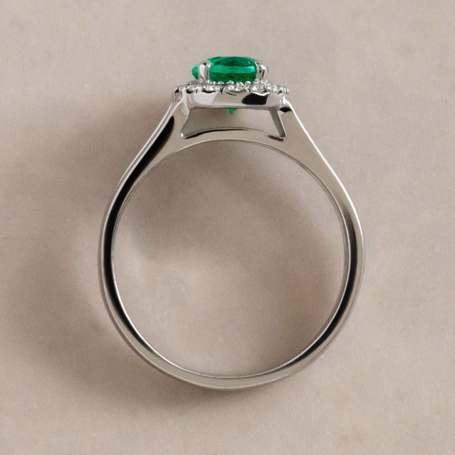 0.72 Carat Oval Green Emerald Halo Bespoke Engagement Ring in White Gold