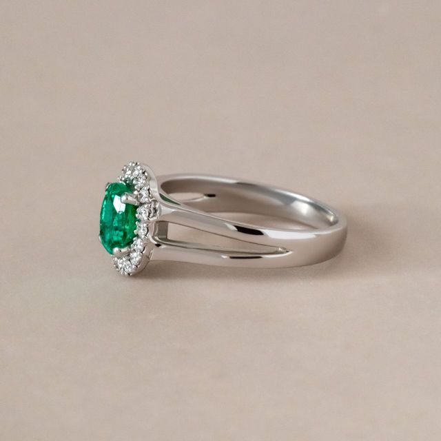 0.72 Carat Oval Green Emerald Halo Bespoke Engagement Ring in White Gold