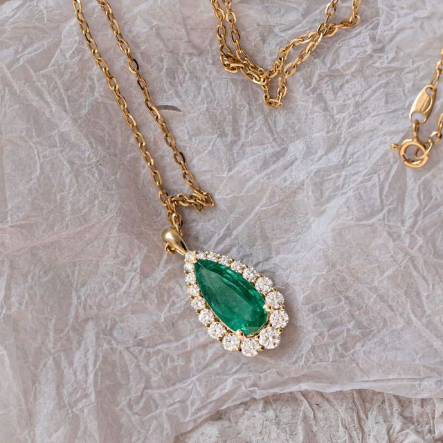 3.62 Carat Natural Pear Emerald Graduated Cluster Halo Pendant in Yellow Gold