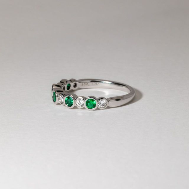 0.50 Carat Round Green Emerald And Diamond Bezel Set Eternity Band in White Gold