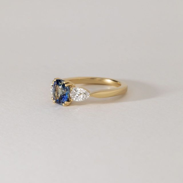 1.74 Carat Natural Cushion Teal Sapphire Trilogy Engagement Ring in Yellow Gold - Nimi