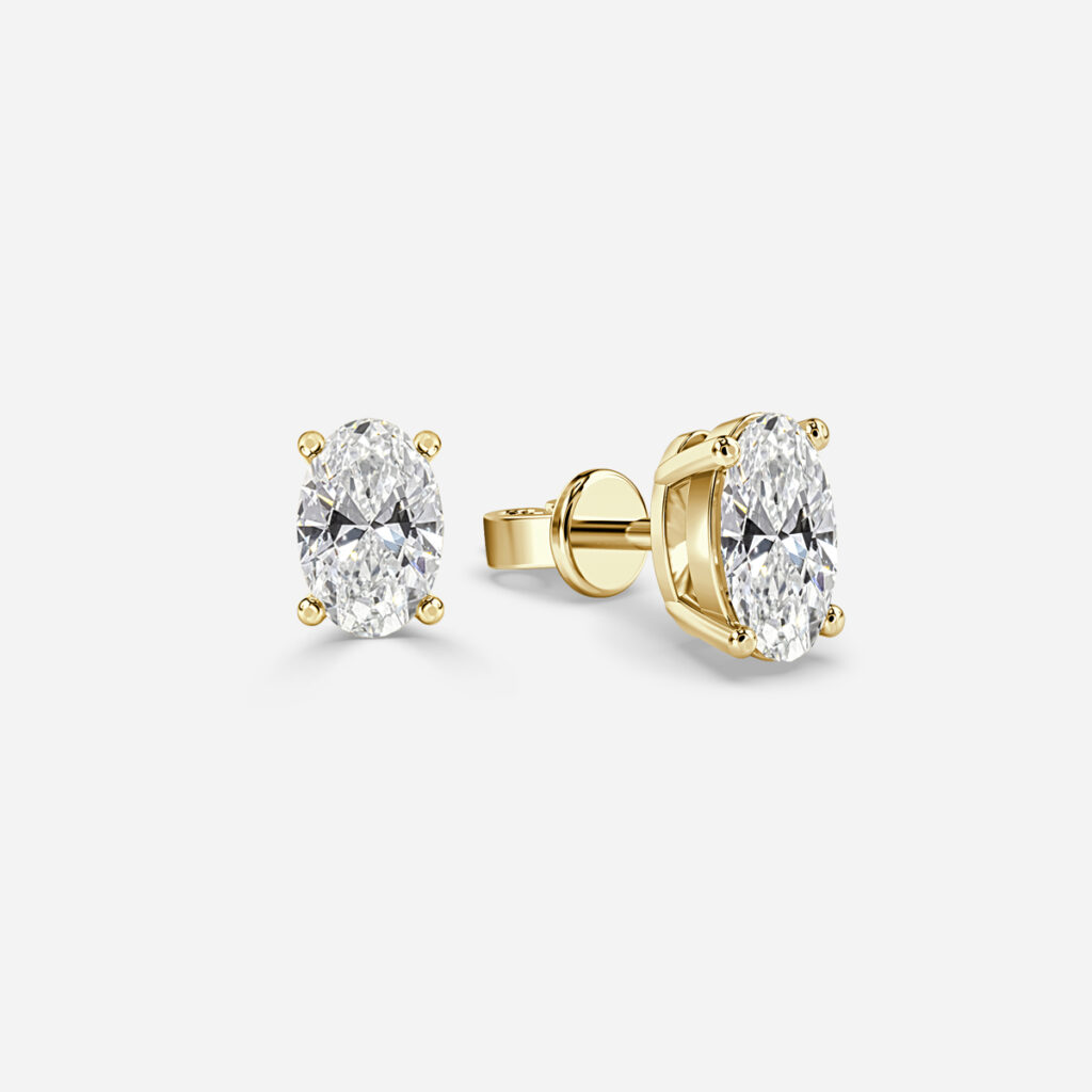 Oval Diamond Stud Earrings In Yellow Gold