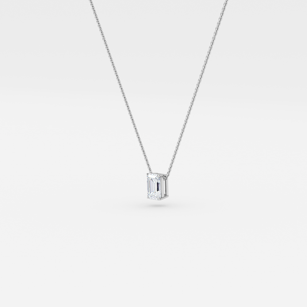 Solitaire Emerald Diamond Pendant In White Gold