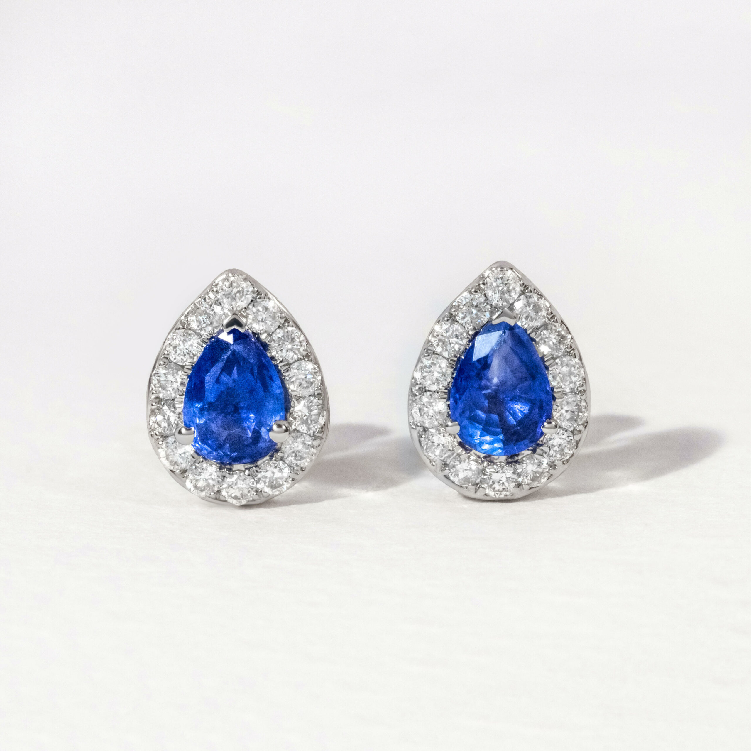 Blue Sapphire Halo Diamond Stud Earring In White Gold