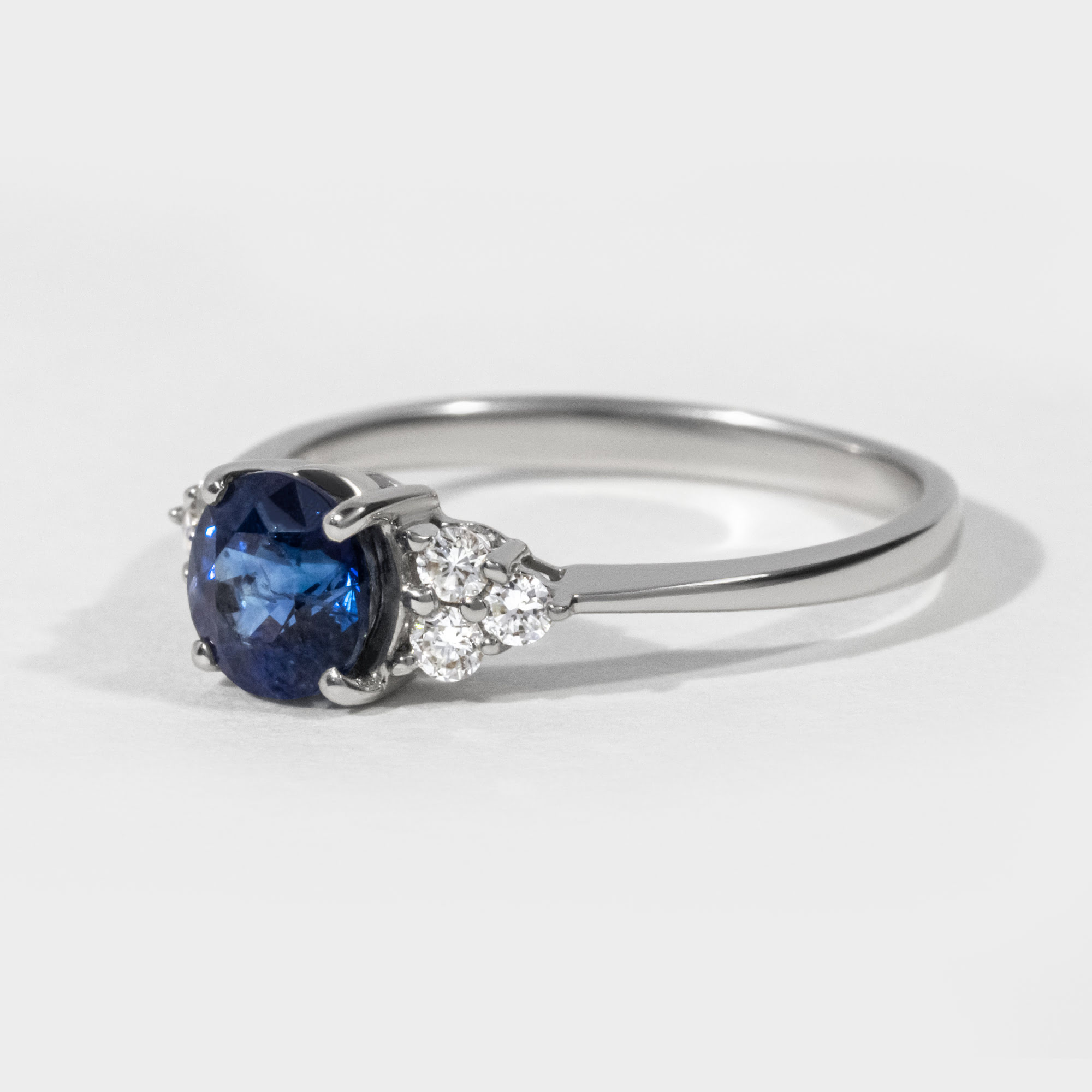 Round Sapphire Trilogy Engagement Ring