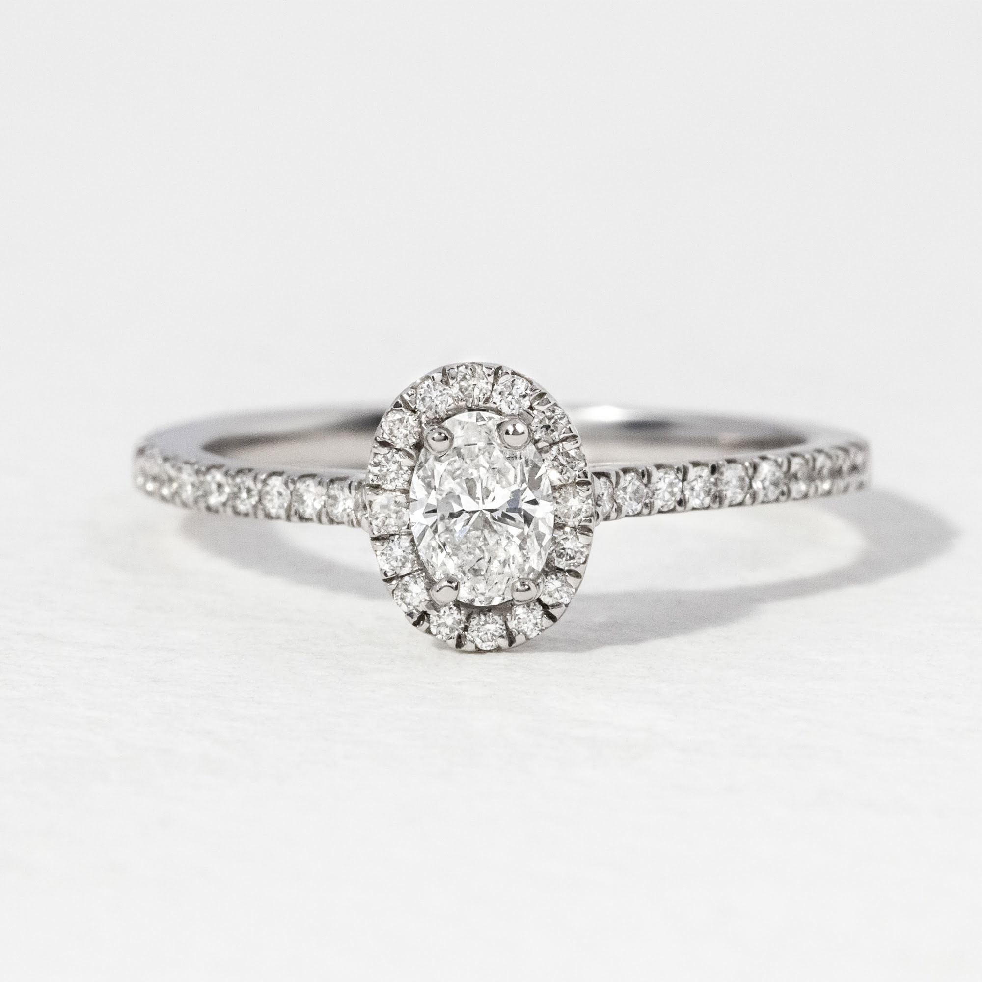0.20 Carat Oval Diamond Platinum Halo Engagement Ring