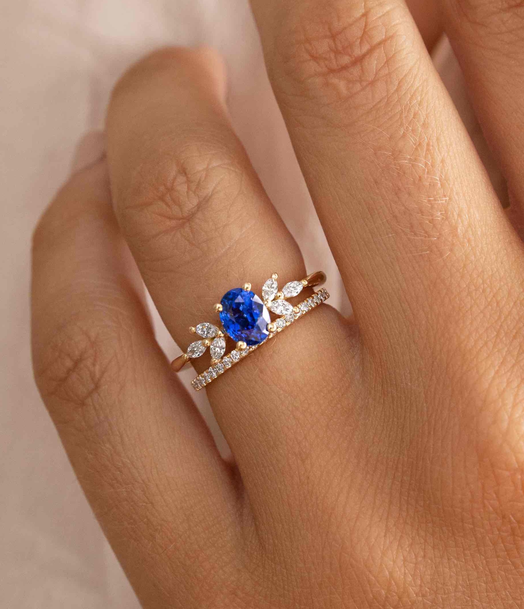golden cluster engagement ring featuring an oval 