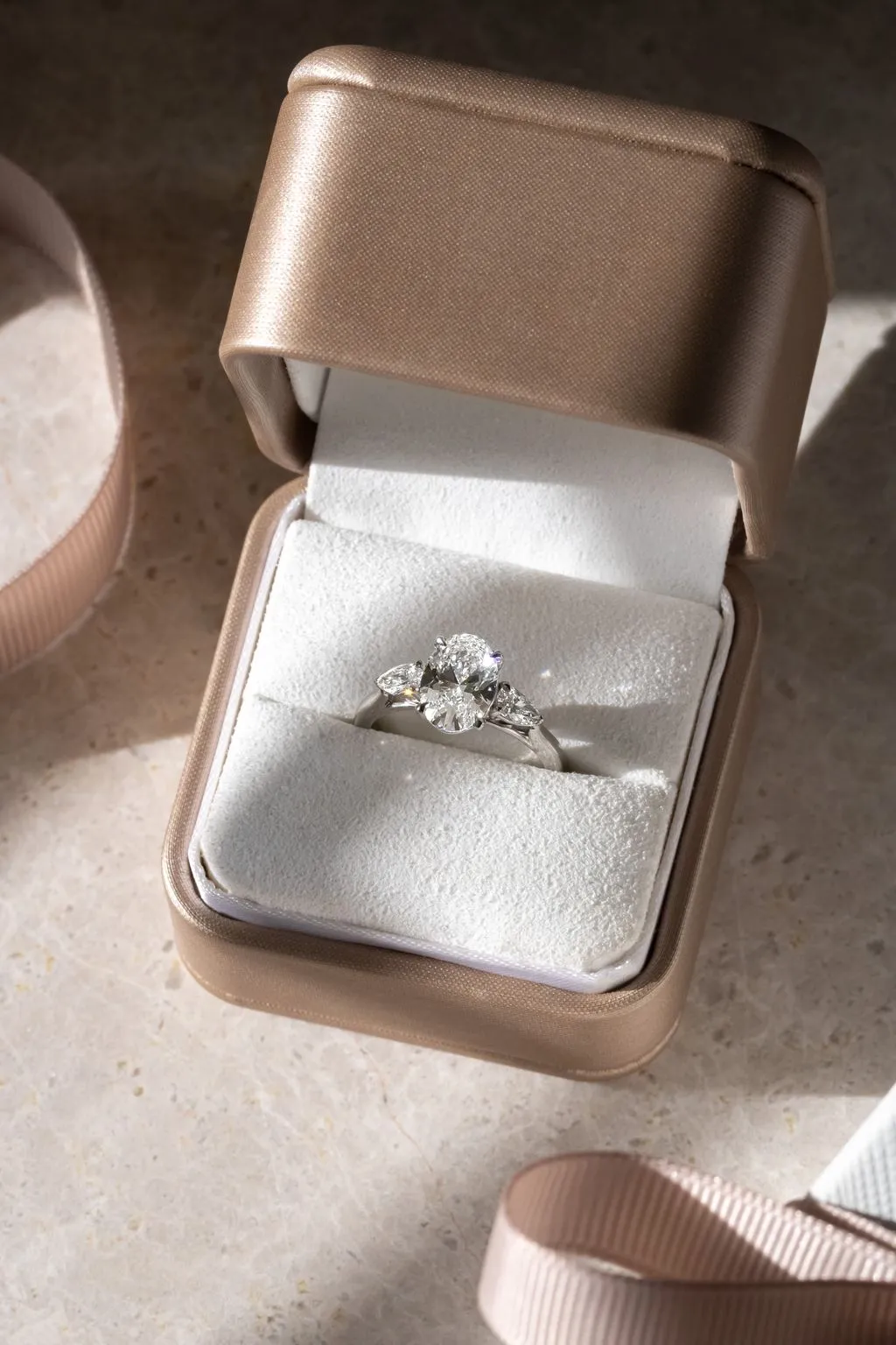 Timeless three stone engagement rings featuring various diamond cuts